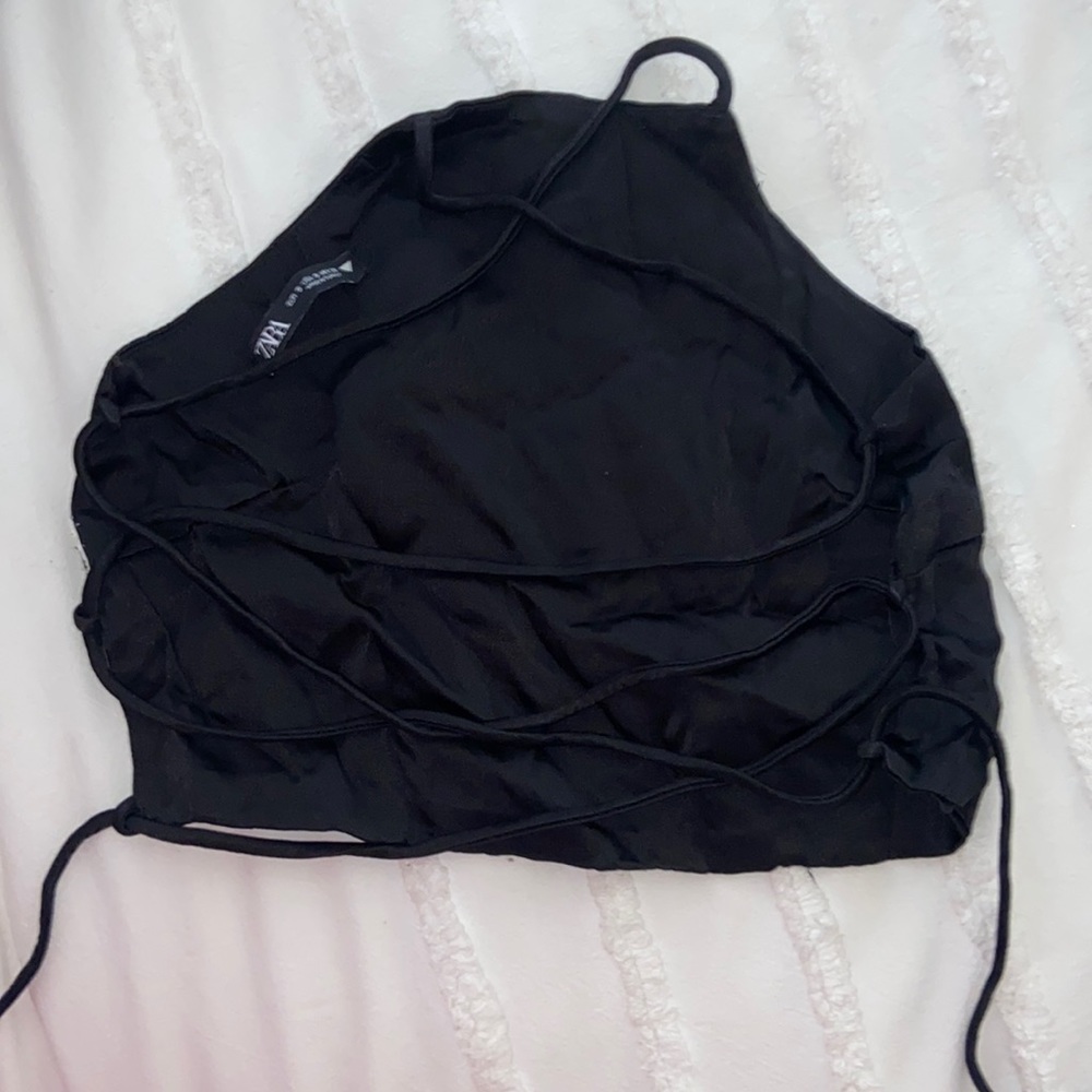 Black, silky, cropped halter—Zara brand. Backless with strappy tie in back.